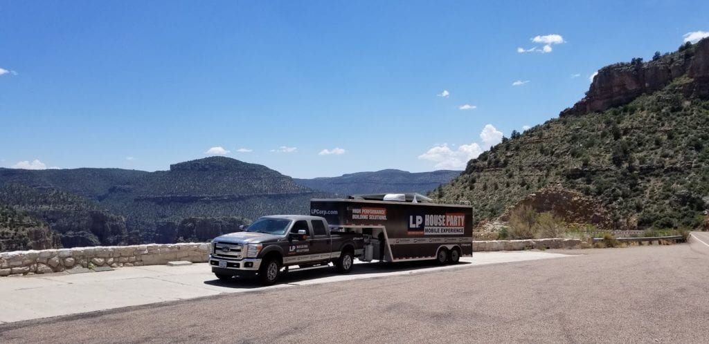 LP's Mobile Experience truck next to a mountain and clear blue sky