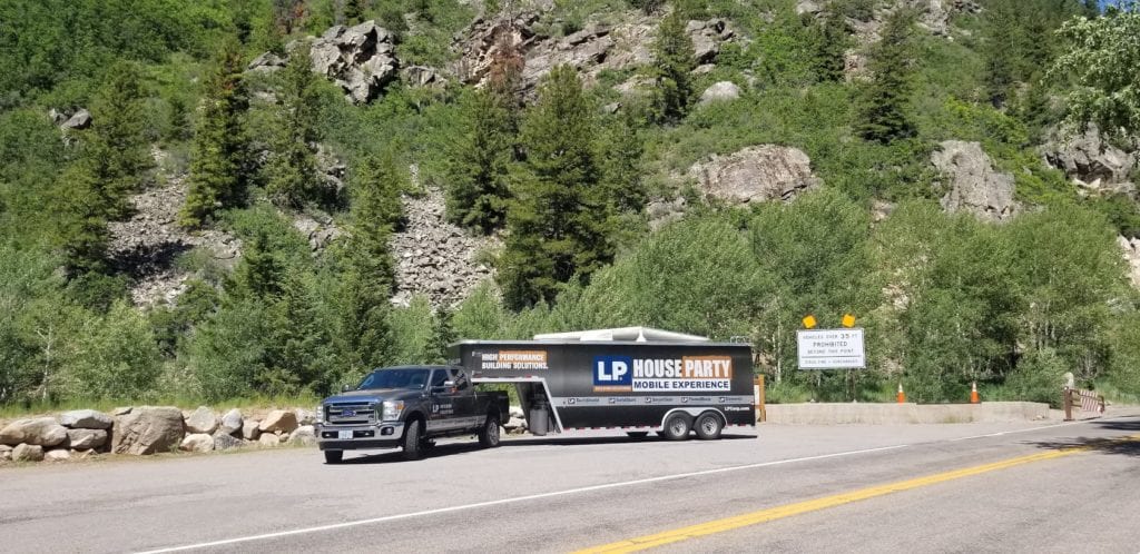 LP's Mobile Experience truck next to a mountain with vegetation